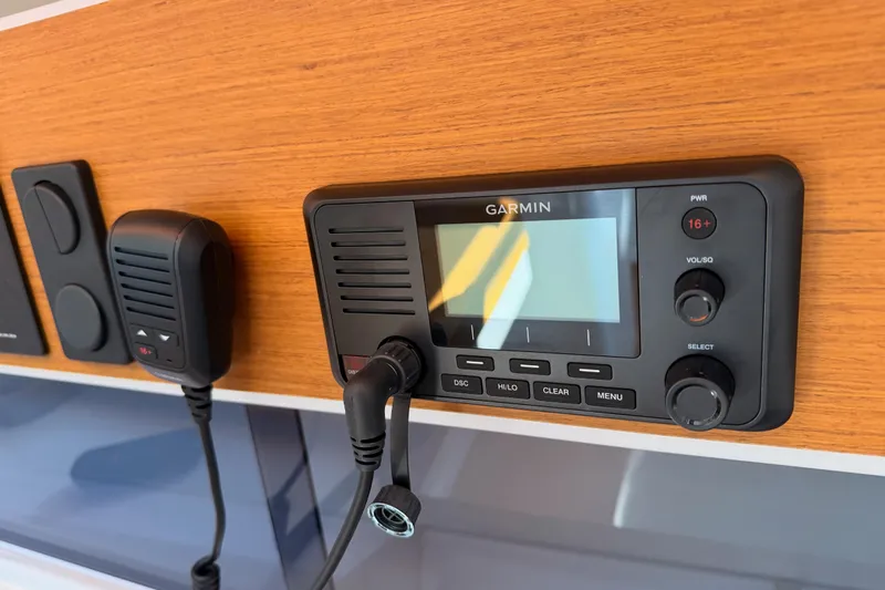 First 36 Yacht Photos Pics Garmin marine radio on 2023 Beneteau First 36 yacht, featuring control panel and microphone.