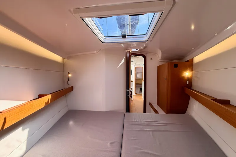 First 36 Yacht Photos Pics Interior cabin of 2023 Beneteau First 36 yacht, featuring modern design and skylight.