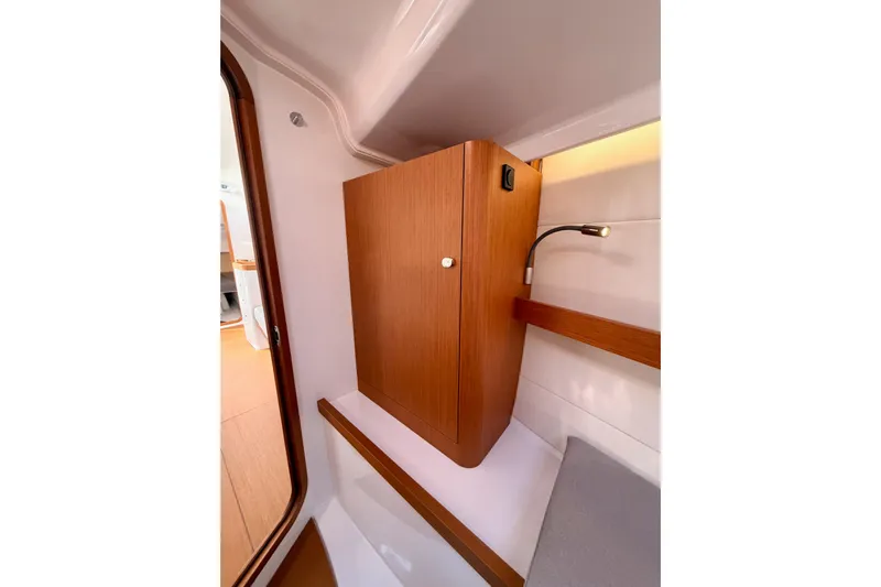 First 36 Yacht Photos Pics Interior of 2023 Beneteau First 36 yacht, featuring wooden cabinetry and modern lighting.