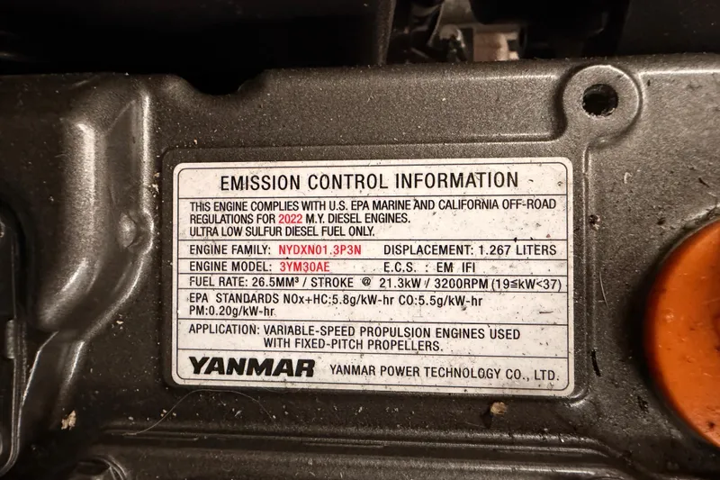 First 36 Yacht Photos Pics ```json { "alt_text": "Yanmar engine emission control label on 2023 Beneteau First 36." } ```