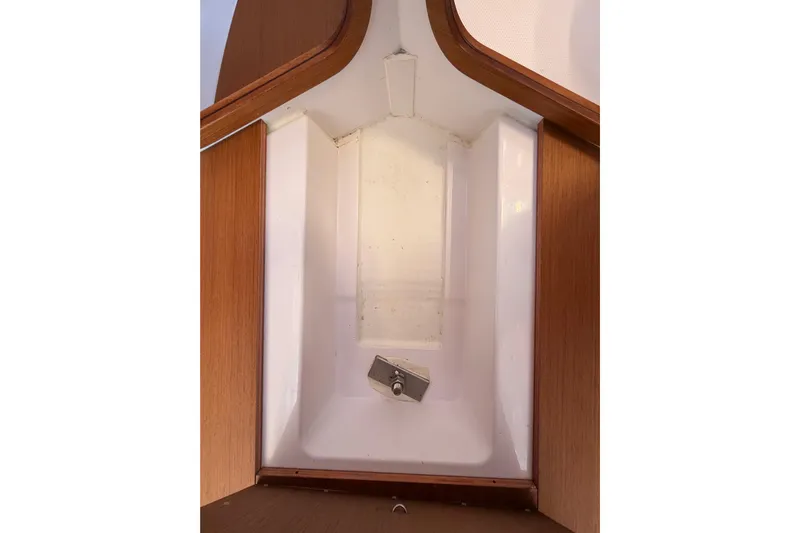 First 36 Yacht Photos Pics Interior view of 2023 Beneteau First 36 sailboat, showcasing sleek wooden and white design.