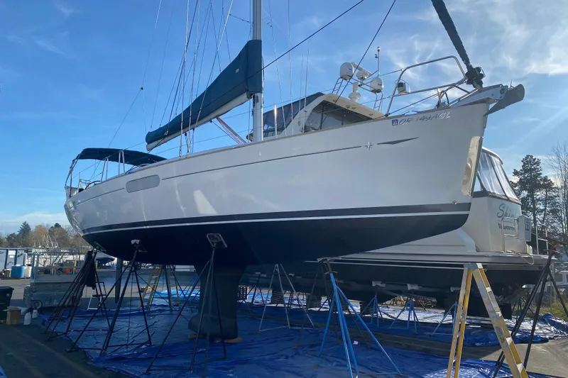 Flyer Yacht Photos Pics Jeanneau Sun Odyssey 44i sailboat from 2010 on stands in a marina.