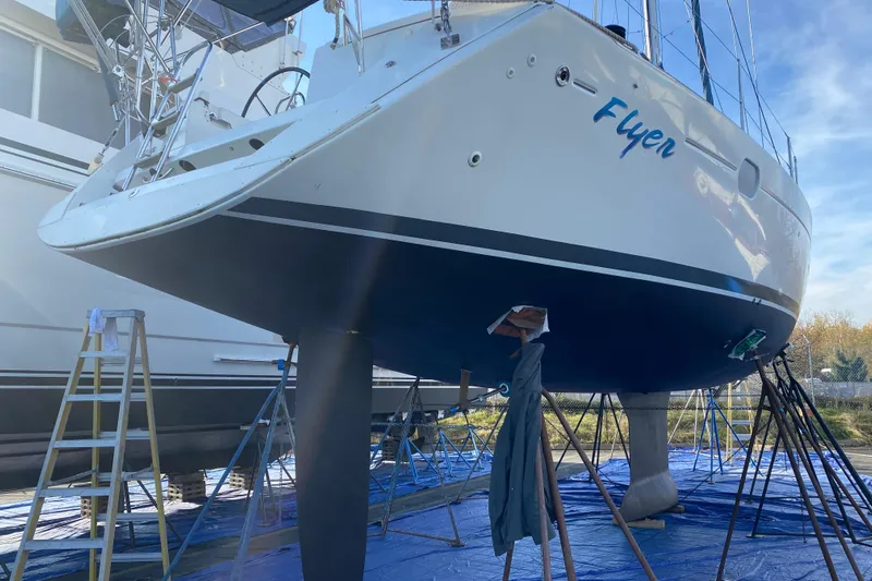 Flyer Yacht Photos Pics Jeanneau Sun Odyssey 44i sailboat, 2010 model, on dry dock for maintenance.