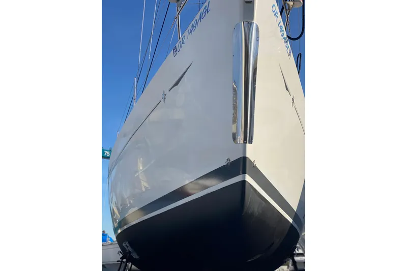 Flyer Yacht Photos Pics 2010 Jeanneau Sun Odyssey 44i sailboat, docked, showcasing sleek hull design.