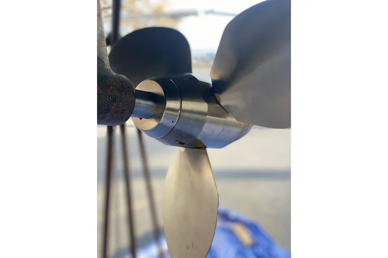 Flyer Yacht Photos Pics Close-up of Jeanneau Sun Odyssey 44i 2010 sailboat propeller, showcasing sleek metal blades.