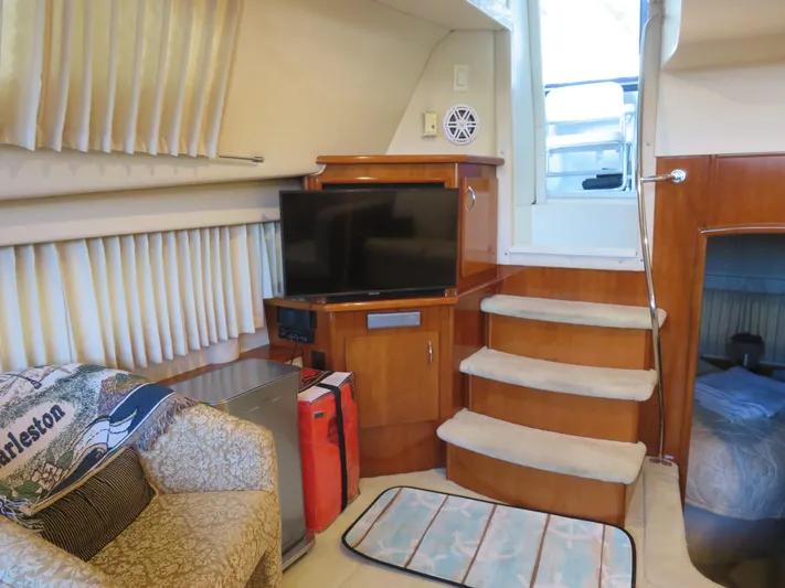 Nepenthe Yacht Photos Pics Interior of 2003 Carver 366 Motor Yacht with TV, stairs, and cozy seating area.