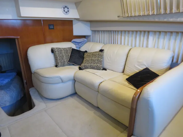 Nepenthe Yacht Photos Pics Luxurious interior of 2003 Carver 366 Motor Yacht with cream leather sofa and decorative pillows.