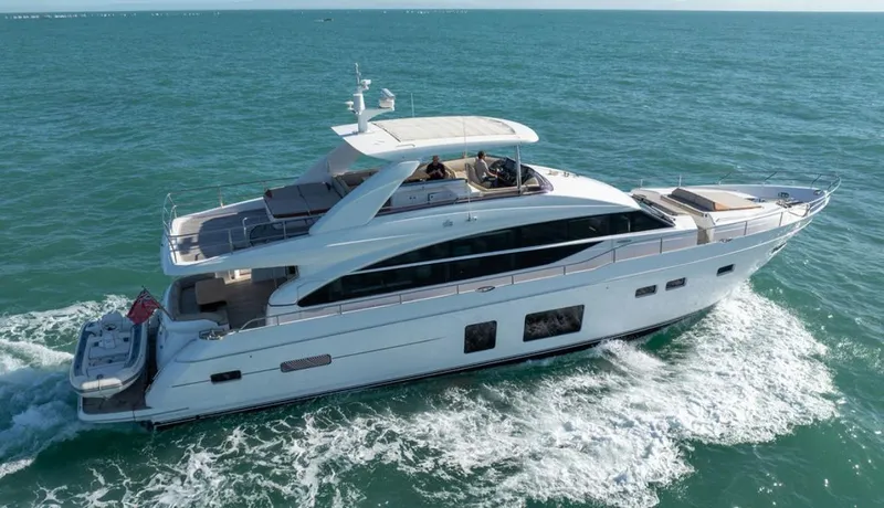  Yacht Photos Pics Luxurious 2016 Princess 82 yacht cruising on open sea, showcasing sleek design and elegance.