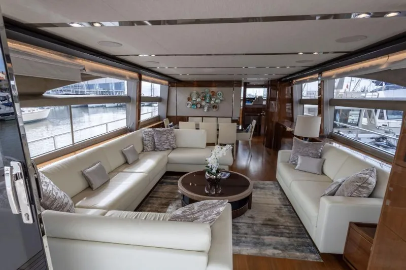  Yacht Photos Pics Luxurious interior of 2016 Princess 82 yacht with elegant seating and panoramic windows.