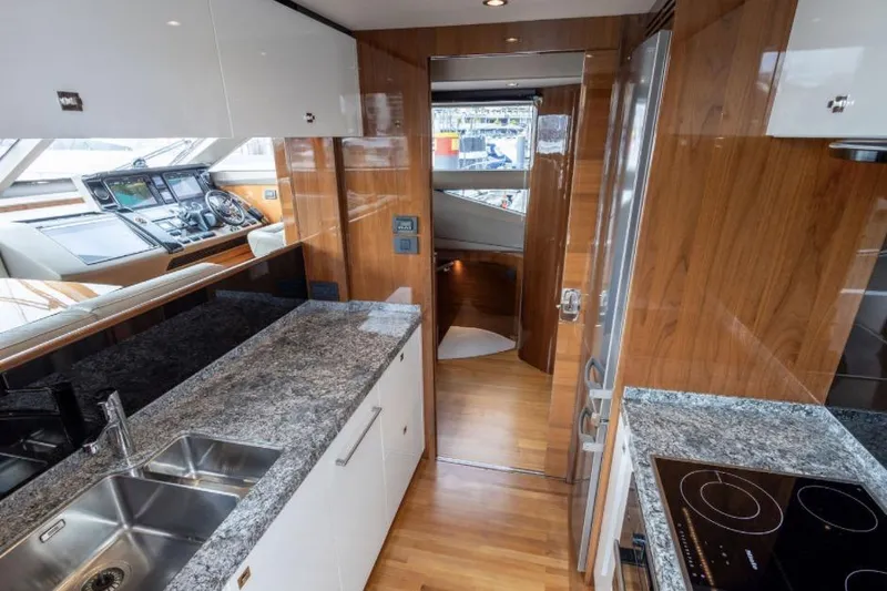  Yacht Photos Pics Luxurious interior of 2016 Princess 82 yacht with modern kitchen and navigation area.