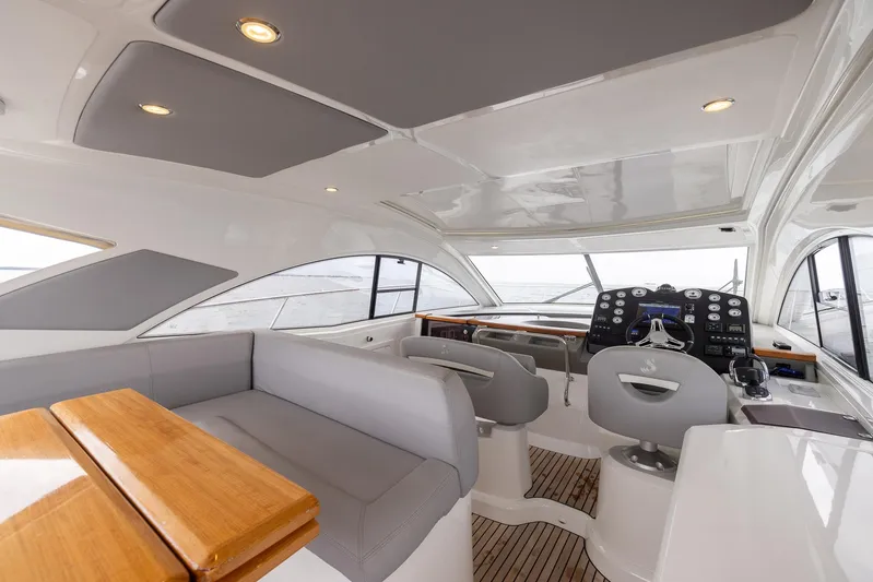 Perseverance Yacht Photos Pics Luxurious interior of 2014 Beneteau Gran Turismo 44 yacht with modern seating and helm.