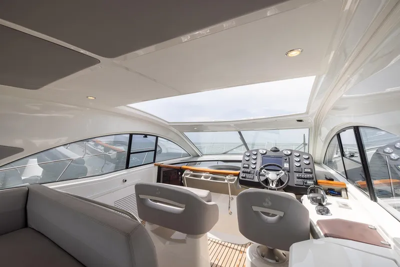Perseverance Yacht Photos Pics Luxurious interior of 2014 Beneteau Gran Turismo 44 yacht with modern helm and seating.