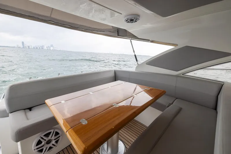 Perseverance Yacht Photos Pics Beneteau Gran Turismo 44 yacht interior with wooden table and ocean view, 2014 model.