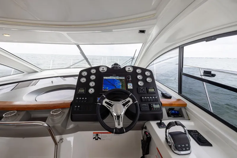Perseverance Yacht Photos Pics Helm of 2014 Beneteau Gran Turismo 44 yacht with navigation controls and sea view.