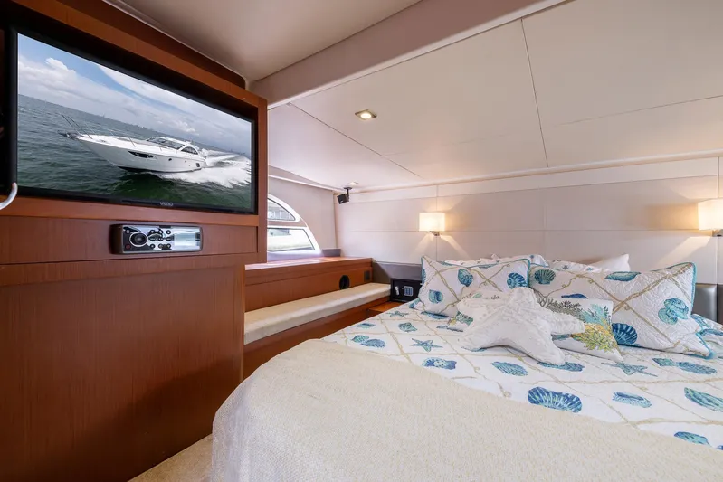 Perseverance Yacht Photos Pics Luxurious bedroom interior of 2014 Beneteau Gran Turismo 44 yacht with cozy bedding and TV.