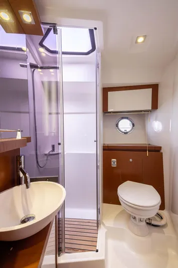 Perseverance Yacht Photos Pics Luxurious bathroom in 2014 Beneteau Gran Turismo 44 yacht with modern fixtures.