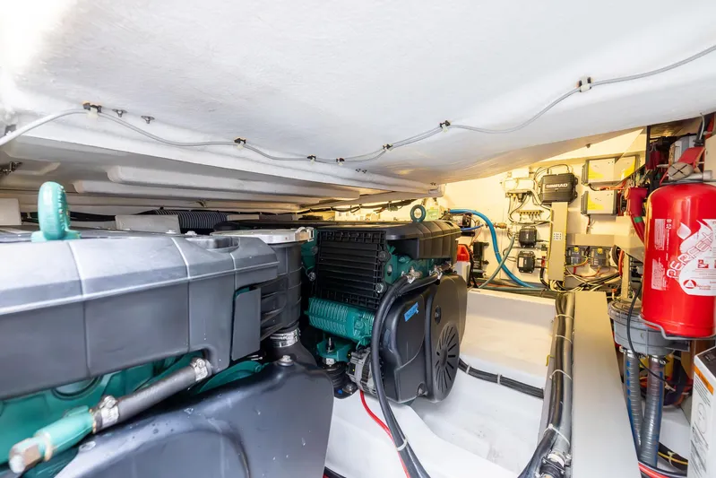 Perseverance Yacht Photos Pics Engine room of 2014 Beneteau Gran Turismo 44 with visible machinery and fire extinguisher.