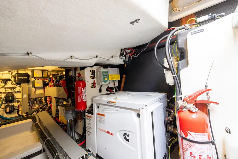 Perseverance Yacht Photos Pics Engine room of 2014 Beneteau Gran Turismo 44 with Cummins Onan generator and safety equipment.