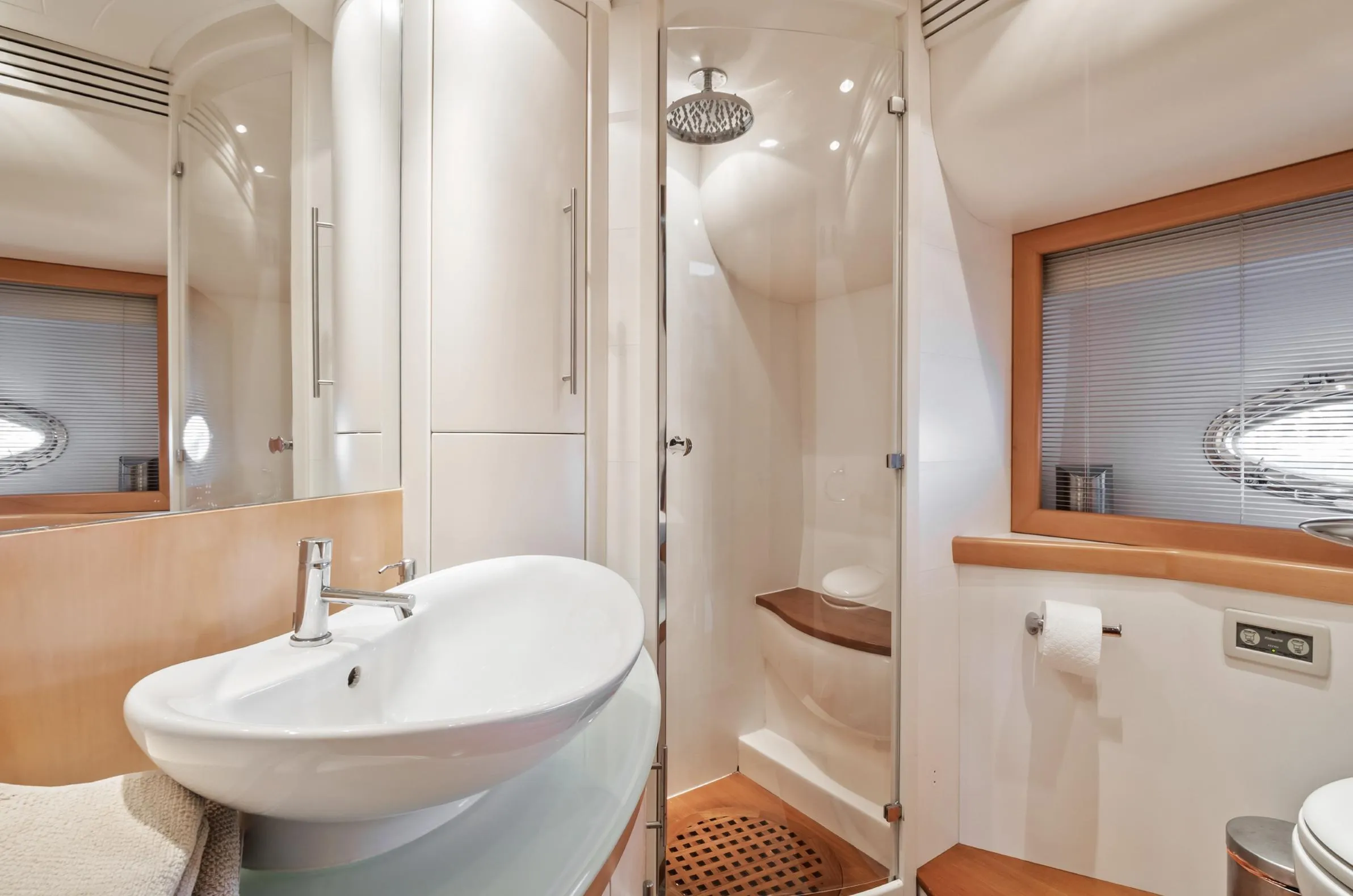 Luxurious bathroom interior of 2005 Pershing 76 yacht with modern fixtures and shower.