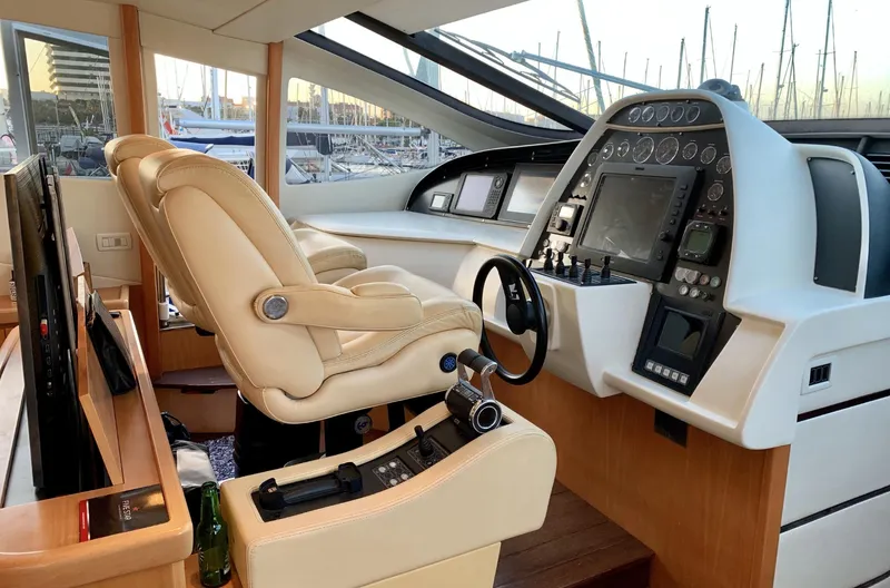  Yacht Photos Pics Luxurious 2005 Pershing 76 yacht cockpit with leather seats and advanced navigation controls.