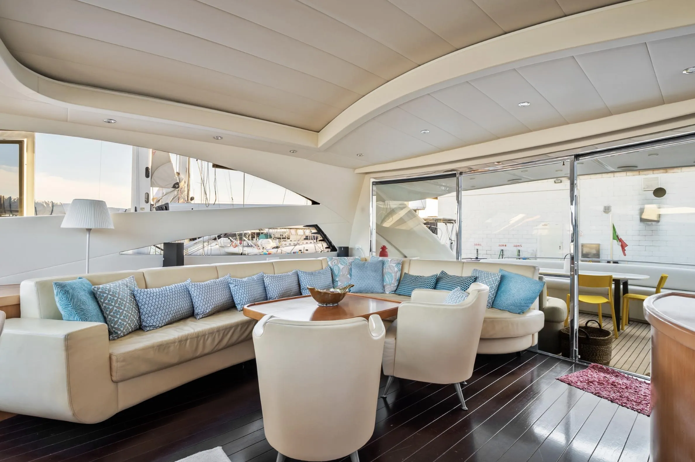 Luxurious interior of 2005 Pershing 76 yacht with elegant seating and modern design.