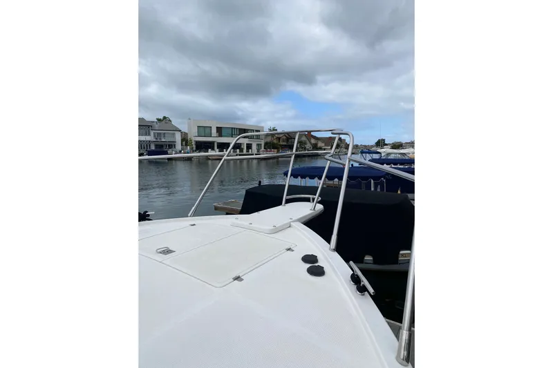  Yacht Photos Pics 2012 Mikelson 43 Sportfisher docked, showcasing bow and waterfront view.