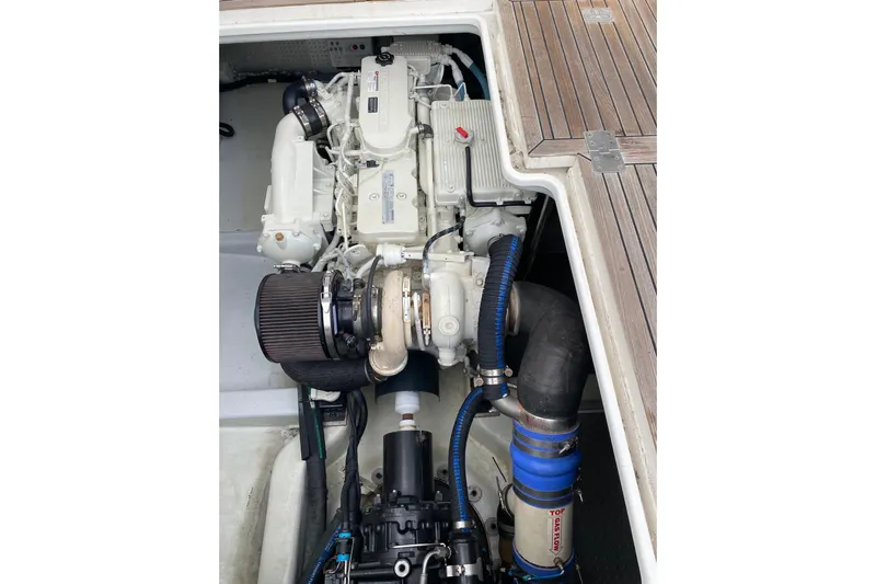  Yacht Photos Pics Engine compartment of 2012 Mikelson 43 Sportfisher with visible components and hoses.