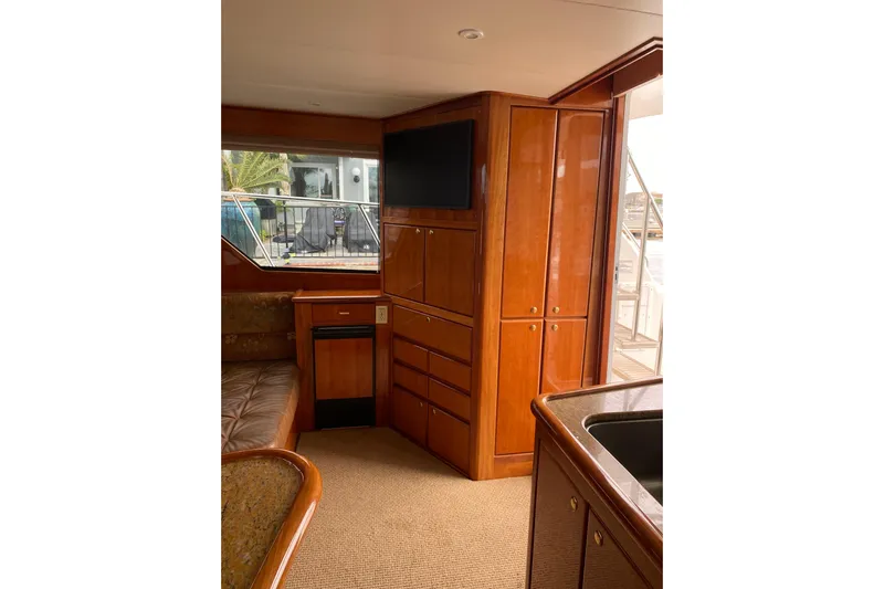  Yacht Photos Pics Interior of 2012 Mikelson 43 Sportfisher yacht with wood cabinetry and modern amenities.