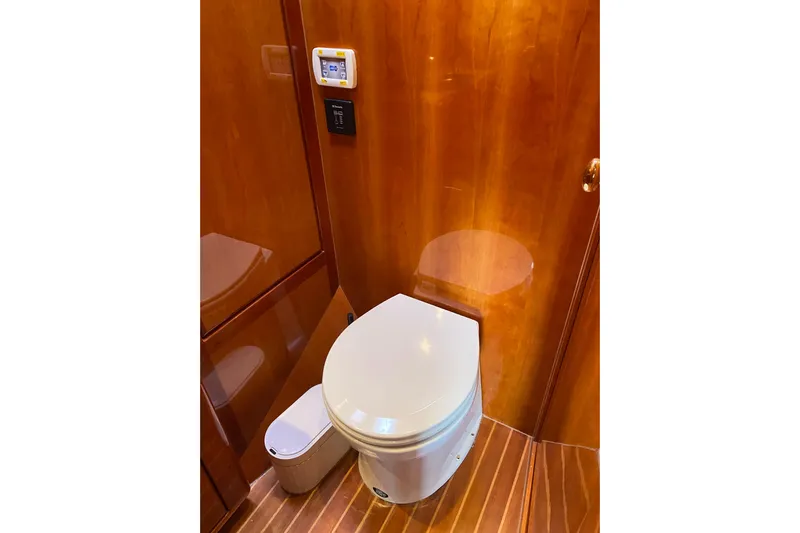  Yacht Photos Pics Luxury wooden bathroom interior on 2012 Mikelson 43 Sportfisher yacht.