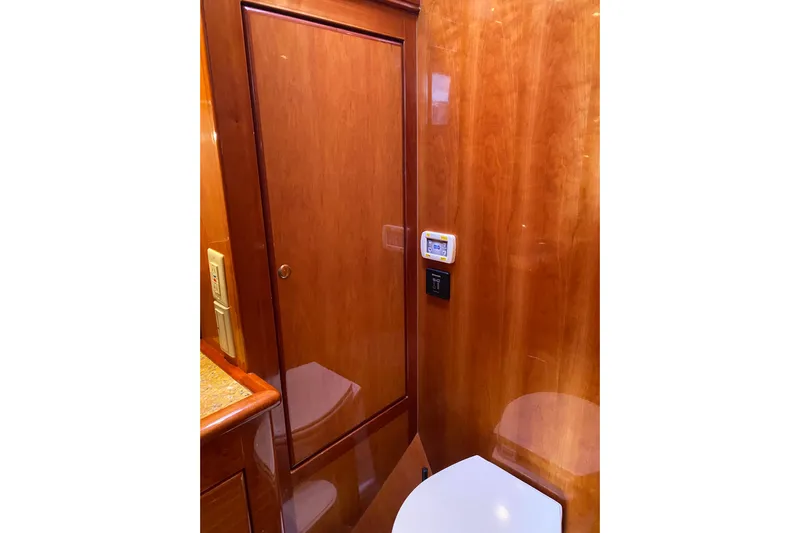  Yacht Photos Pics Luxurious wooden interior of 2012 Mikelson 43 Sportfisher yacht bathroom.