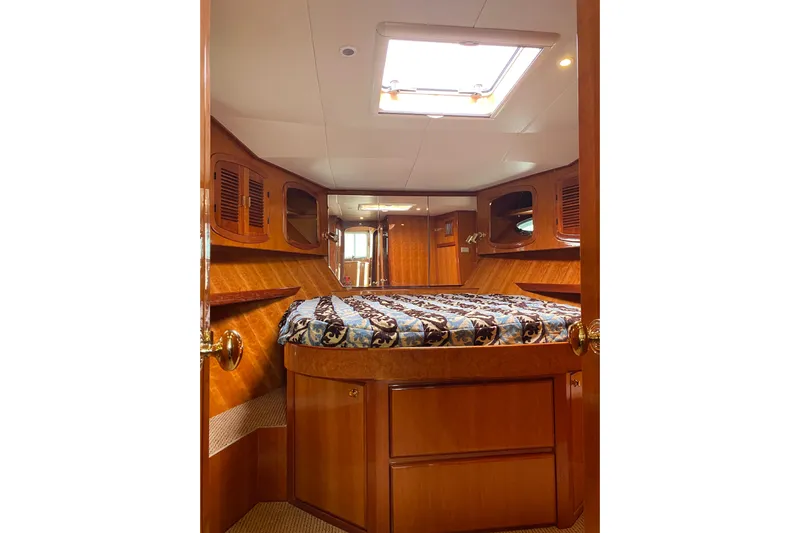  Yacht Photos Pics Luxurious cabin interior of 2012 Mikelson 43 Sportfisher yacht with wood finish.