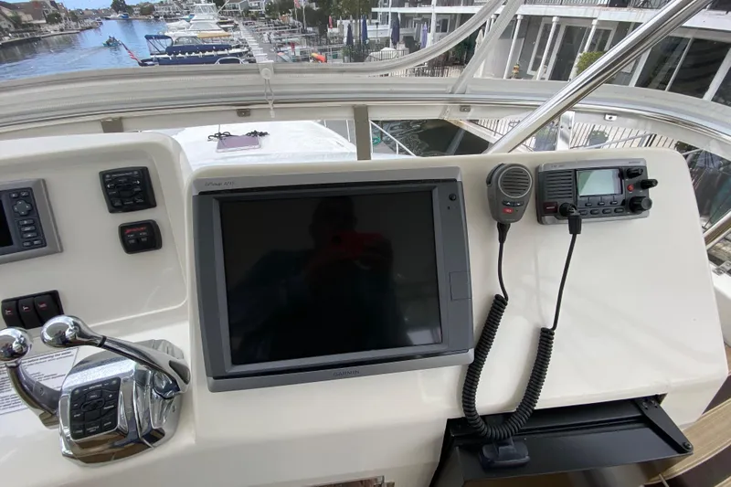 Yacht Photos Pics Control panel of a 2012 Mikelson 43 Sportfisher with navigation and communication equipment.