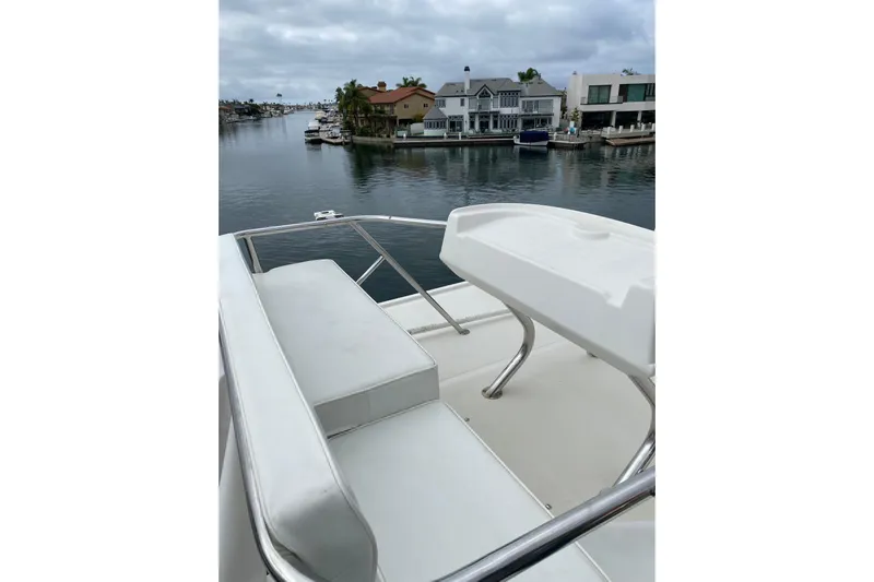  Yacht Photos Pics 2012 Mikelson 43 Sportfisher yacht with waterfront view and luxurious seating.