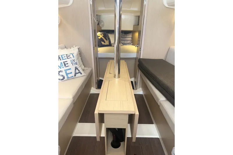 Al Di La Yacht Photos Pics Interior of 2020 Beneteau Oceanis 30.1 sailboat with cozy seating and nautical decor.