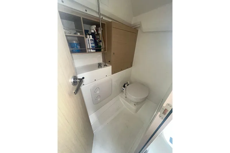 Al Di La Yacht Photos Pics Beneteau Oceanis 30.1 2020 yacht bathroom with toilet and storage shelves.