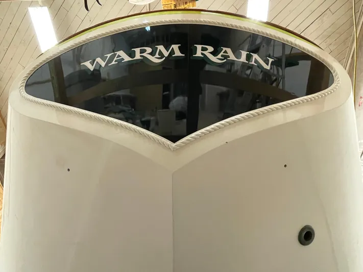 "warm Rain Ii" Yacht Photos Pics Custom 1992 Bruce King boat named "Warm Rain" with sleek design in a workshop setting.