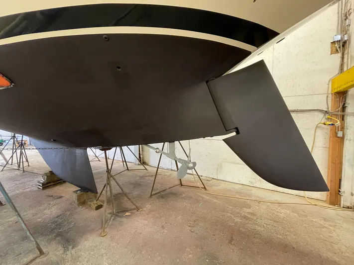 "warm Rain Ii" Yacht Photos Pics Bottom view of a 1992 Custom Bruce King boat in a workshop.