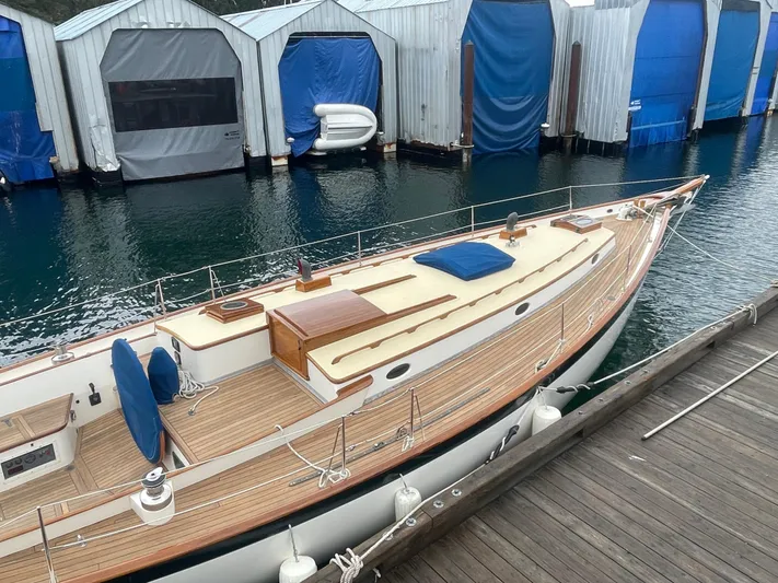 "warm Rain Ii" Yacht Photos Pics Custom 1992 Bruce King sailboat docked near covered boat slips.