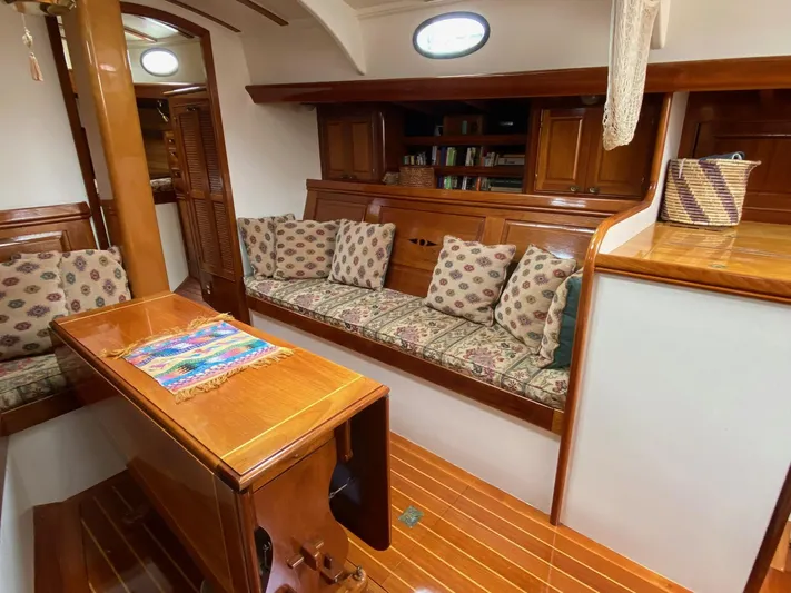 "warm Rain Ii" Yacht Photos Pics Luxurious 1992 Bruce King custom yacht interior with elegant wood finish and cozy seating area.