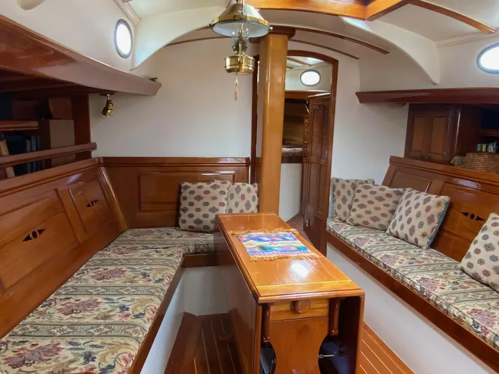 "warm Rain Ii" Yacht Photos Pics Luxurious 1992 Bruce King custom yacht interior with elegant wood finish and patterned cushions.