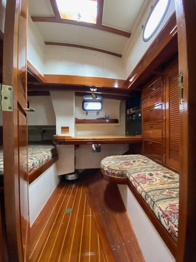 "warm Rain Ii" Yacht Photos Pics Cozy 1992 Bruce King custom boat interior with wood finish and patterned seating.