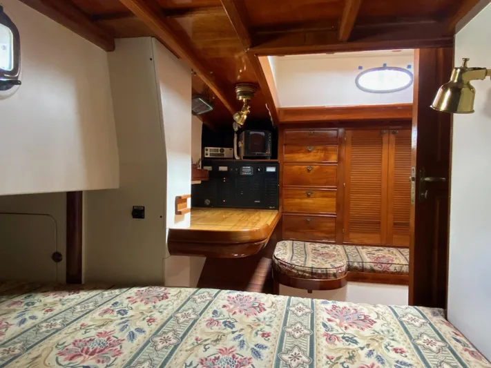 "warm Rain Ii" Yacht Photos Pics Cozy 1992 Bruce King custom boat interior with wood paneling and floral upholstery.