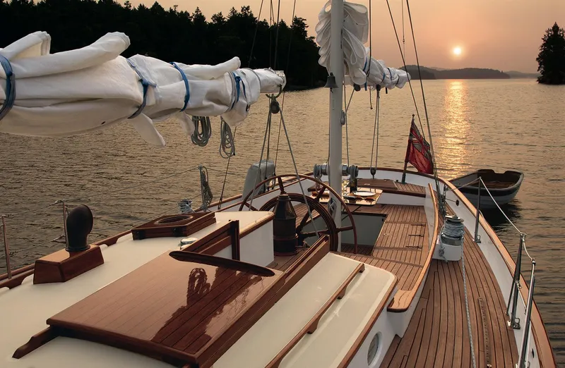 "warm Rain Ii" Yacht Photos Pics Sailing yacht at sunset, Custom Bruce King 1992, serene water, elegant wooden deck.