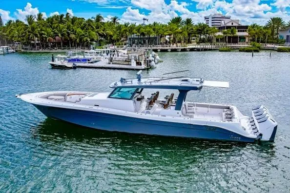  Yacht Photos Pics 2026 HCB 56 Suenos GIX luxury boat docked in a scenic marina setting.