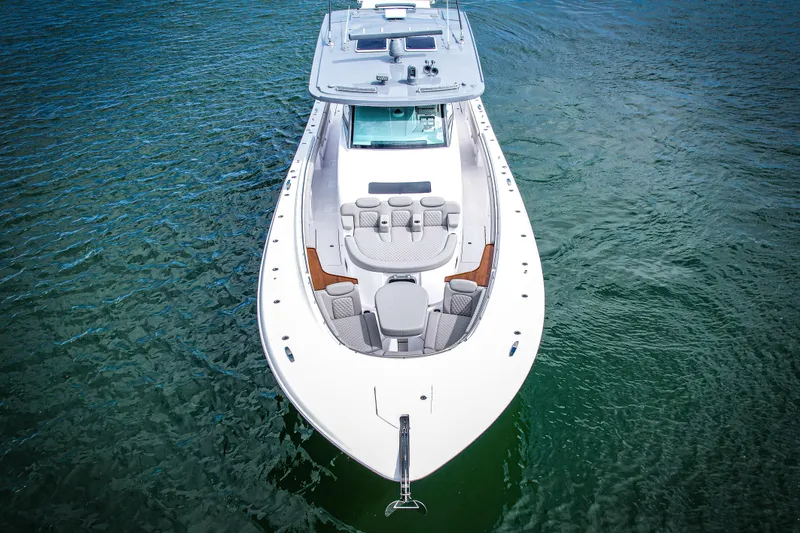  Yacht Photos Pics 2026 HCB 56 Suenos GIX luxury boat on clear water, aerial view.