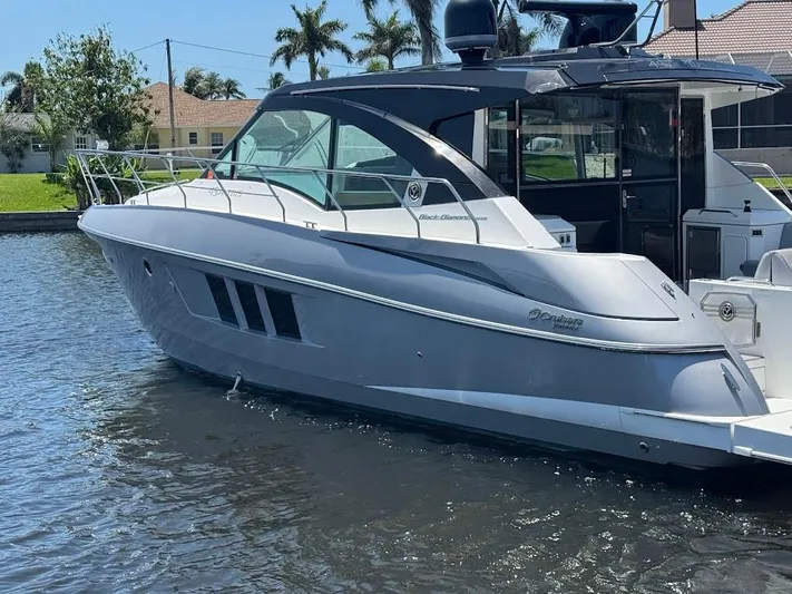  Yacht Photos Pics 2014 Cruisers Yachts 45 Cantius Black Diamond on water, sleek design, luxury motor yacht.