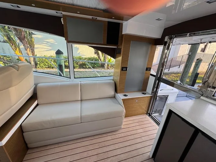  Yacht Photos Pics Interior of 2014 Cruisers Yachts 45 Cantius Black Diamond with modern seating and large windows.
