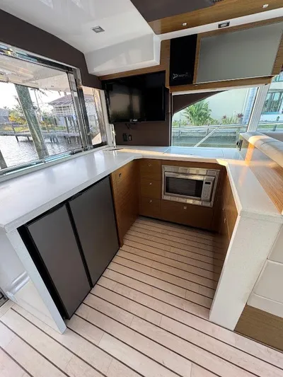  Yacht Photos Pics Modern kitchen interior of 2014 Cruisers Yachts 45 Cantius Black Diamond.