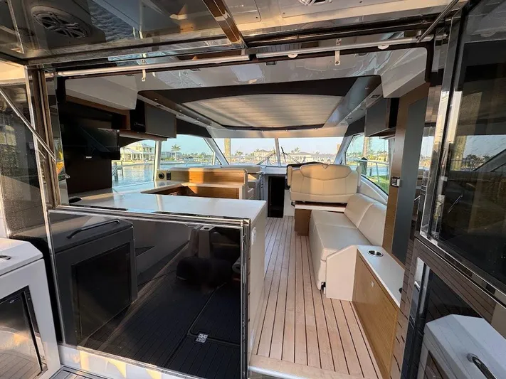  Yacht Photos Pics 2014 Cruisers Yachts 45 Cantius Black Diamond interior with modern seating and panoramic windows.