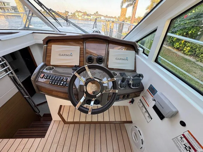  Yacht Photos Pics Helm of 2014 Cruisers Yachts 45 Cantius Black Diamond with Garmin displays and modern controls.